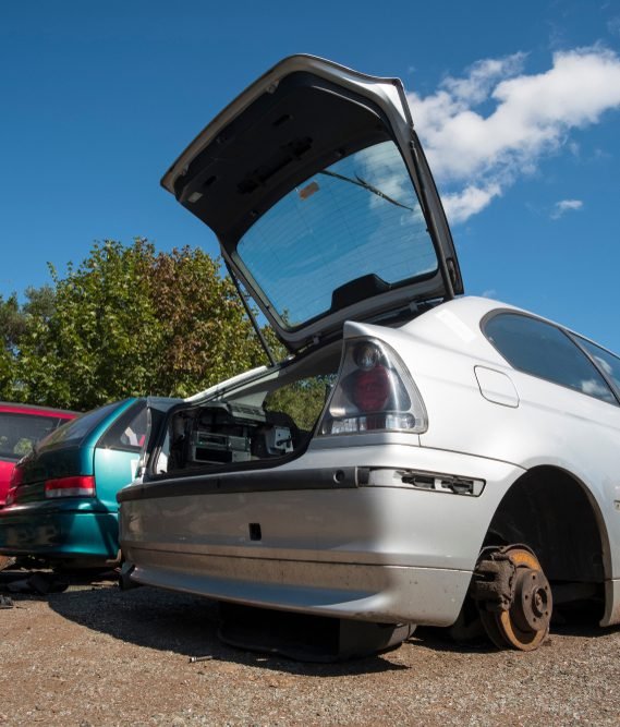 junk car stopped in a scrap car yard